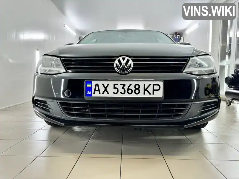 Седан Volkswagen Jetta 2013 2 л. Автомат обл. Харьковская, Харьков - Фото 1/21