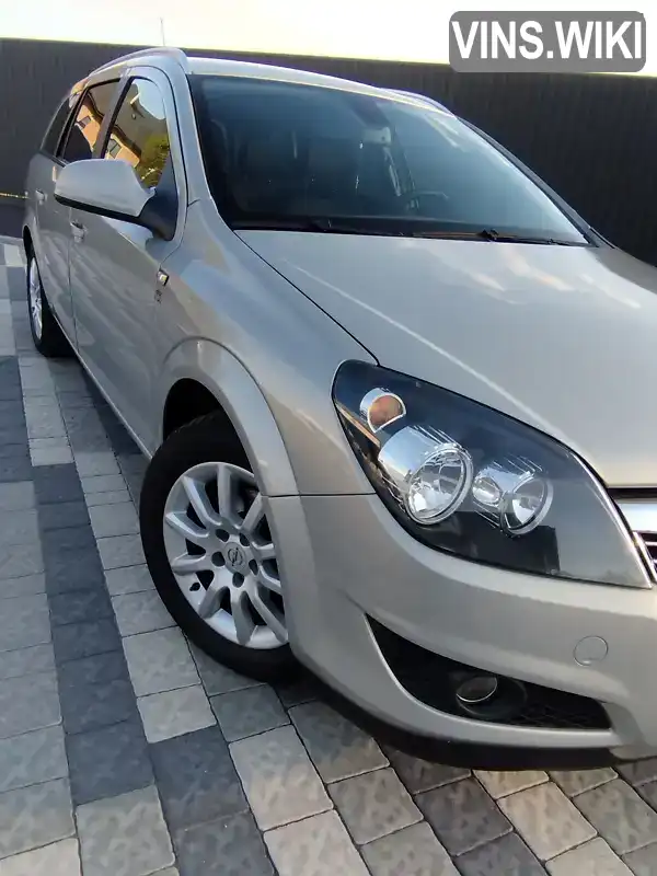 W0L0AHL35A2070601 Opel Astra 2010 Универсал 1.4 л. Фото 7