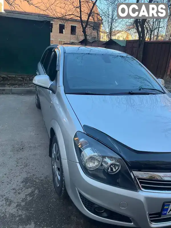 W0L0AHL35B2009643 Opel Astra 2010 Универсал 1.69 л. Фото 5