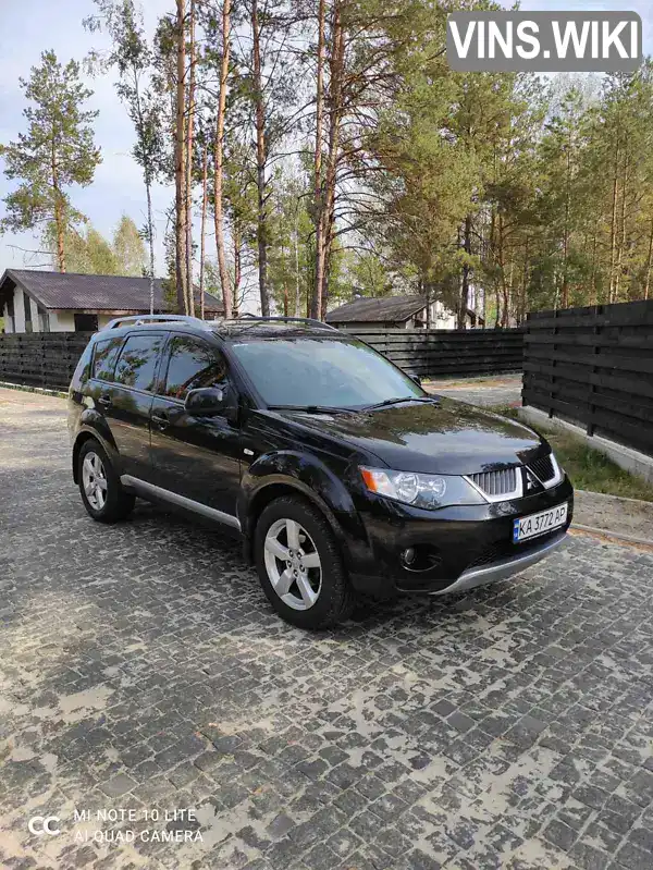 Внедорожник / Кроссовер Mitsubishi Outlander XL 2008 2.4 л. Вариатор обл. Киевская, Вышневое - Фото 1/13