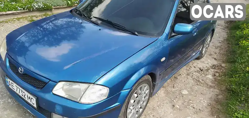 Седан Mazda 323 1999 1.6 л. Ручна / Механіка обл. Дніпропетровська, Дніпро (Дніпропетровськ) - Фото 1/11