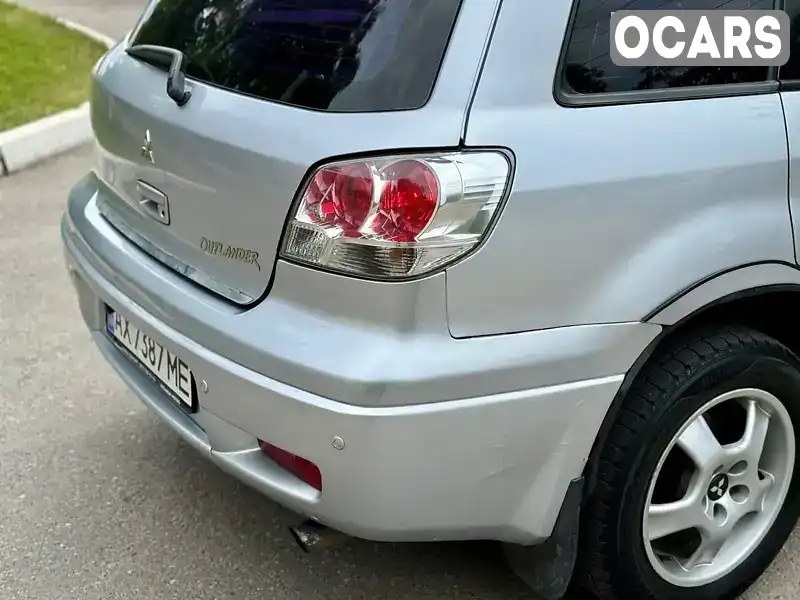 JMYXRCU4W3U779506 Mitsubishi Outlander 2003 Внедорожник / Кроссовер 2.35 л. Фото 6