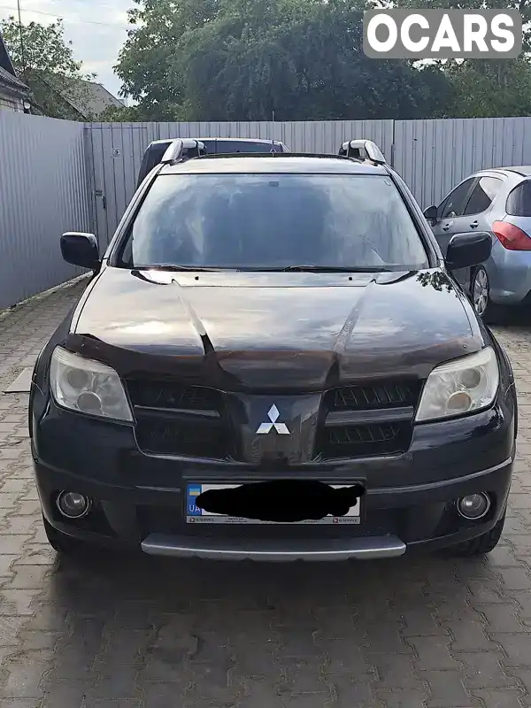 Позашляховик / Кросовер Mitsubishi Outlander 2008 2.38 л. Автомат обл. Житомирська, Житомир - Фото 1/9