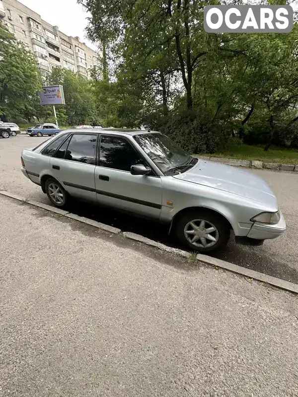 JT1LAT17100075586 Toyota Carina 1990 Хетчбек 1.59 л. Фото 1