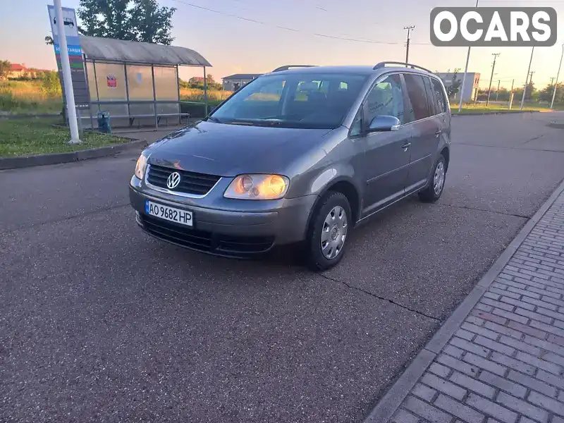 Мінівен Volkswagen Touran 2006 1.9 л. Ручна / Механіка обл. Закарпатська, Виноградів - Фото 1/21