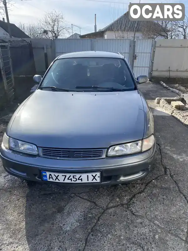 Седан Mazda 626 1994 null_content л. Ручна / Механіка обл. Харківська, Слобожанське - Фото 1/12