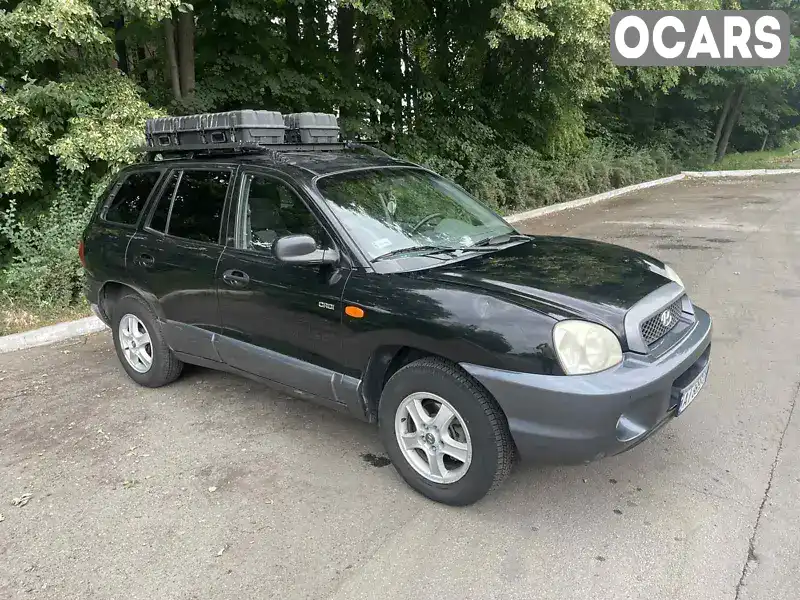 Позашляховик / Кросовер Hyundai Santa FE 2003 1.99 л. Ручна / Механіка обл. Київська, Вишневе - Фото 1/7