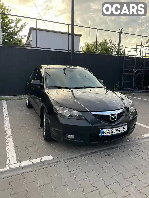 Седан Mazda 3 2006 1.6 л. Ручна / Механіка обл. Київська, Вишневе - Фото 1/21