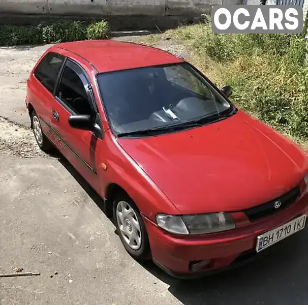 Хетчбек Mazda 323 1997 1.3 л. Ручна / Механіка обл. Дніпропетровська, Дніпро (Дніпропетровськ) - Фото 1/16