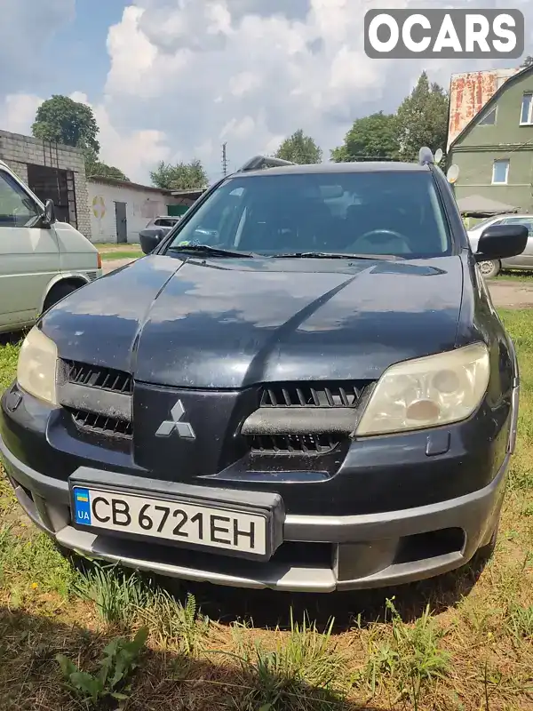 Внедорожник / Кроссовер Mitsubishi Outlander 2006 2.38 л. Вариатор обл. Черновицкая, Черновцы - Фото 1/15