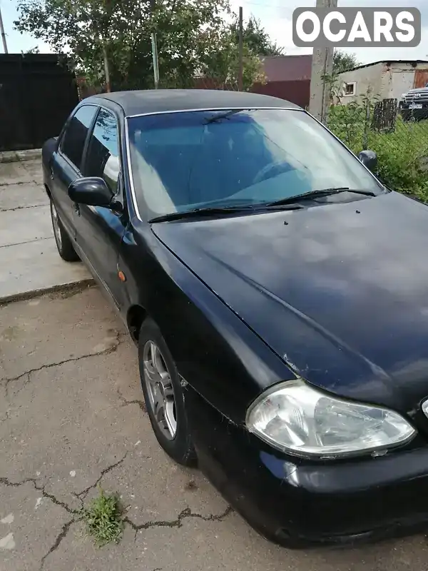 Седан Kia Clarus 1998 1.8 л. Ручна / Механіка обл. Рівненська, Рівне - Фото 1/9