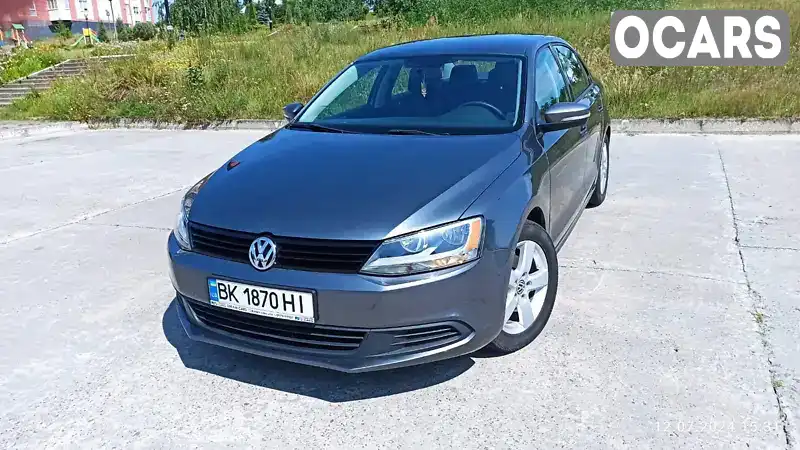 Седан Volkswagen Jetta 2013 1.8 л. Автомат обл. Рівненська, Вараш (Кузнецовськ) - Фото 1/21