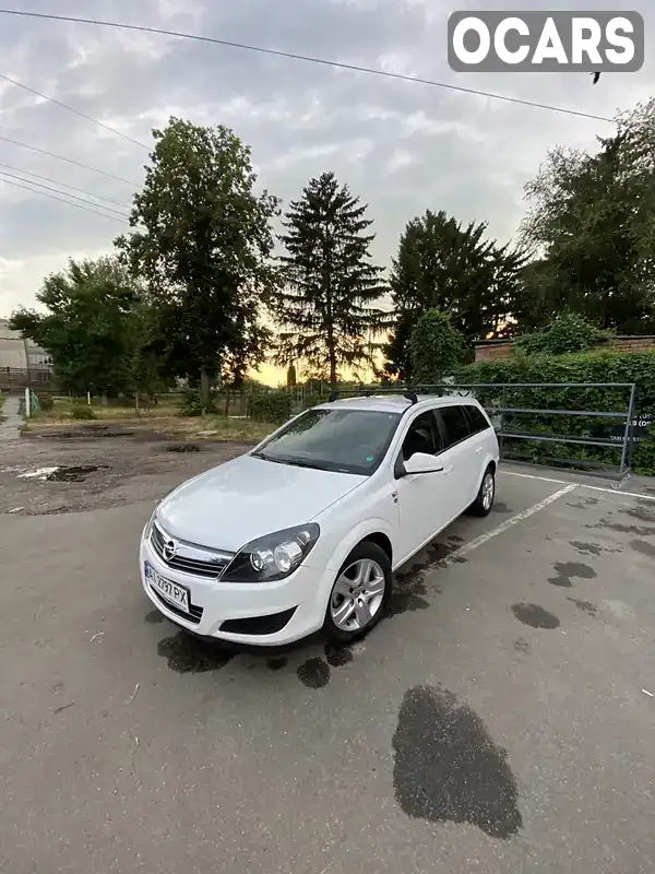 W0L0AHL35A2128691 Opel Astra 2010 Универсал 1.6 л. Фото 1