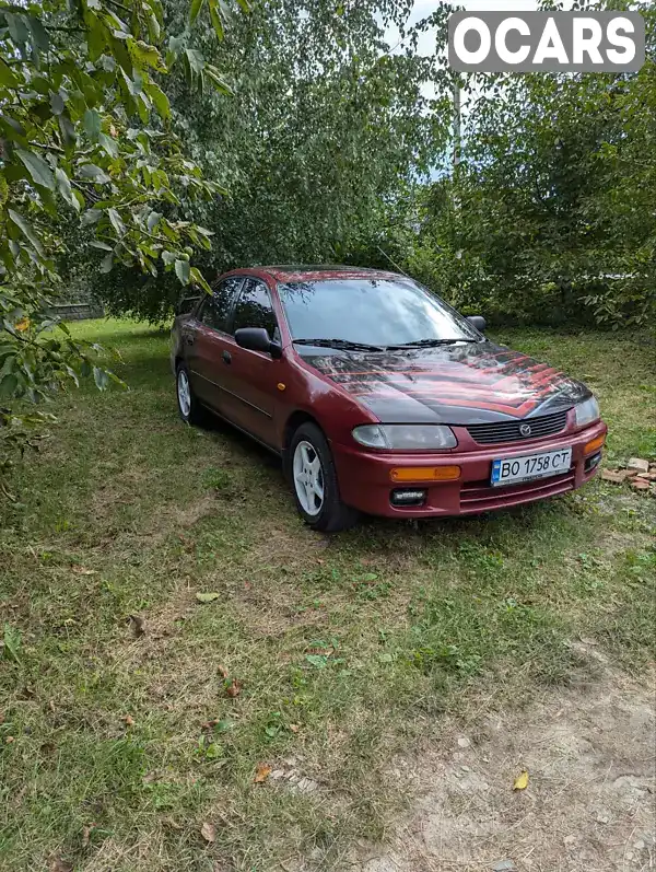 Седан Mazda 323 1996 1.49 л. Ручна / Механіка обл. Хмельницька, Славута - Фото 1/11