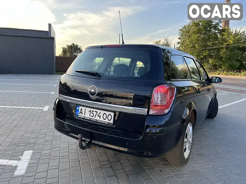 W0L0AHL35A5032936 Opel Astra 2010 Універсал 1.91 л. Фото 9