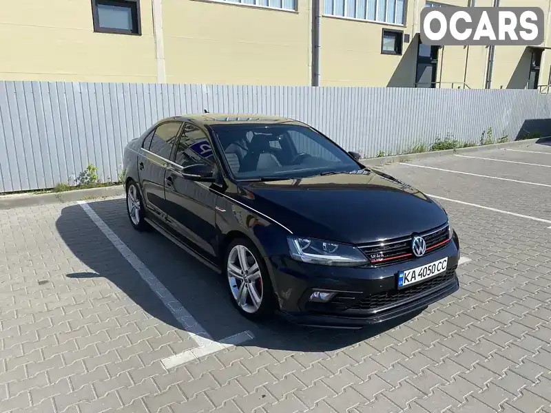 Седан Volkswagen Jetta 2017 2 л. Автомат обл. Київська, Вишневе - Фото 1/21