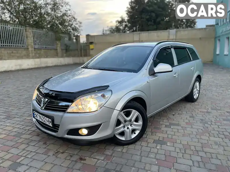 W0L0AHL35A2058346 Opel Astra 2010 Универсал 1.9 л. Фото 1