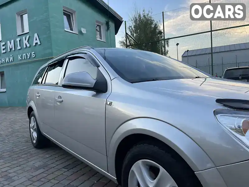 W0L0AHL35A2058346 Opel Astra 2010 Универсал 1.9 л. Фото 7