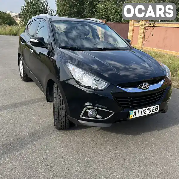 Позашляховик / Кросовер Hyundai ix35 2012 2 л. Автомат обл. Київська, Вишневе - Фото 1/21