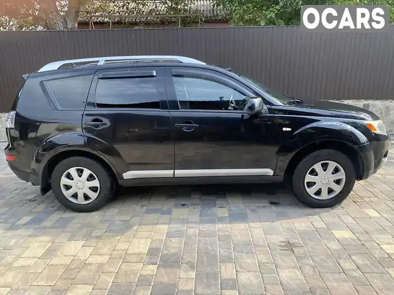 Внедорожник / Кроссовер Mitsubishi Outlander XL 2008 2.36 л. Ручная / Механика обл. Киевская, Киев - Фото 1/7