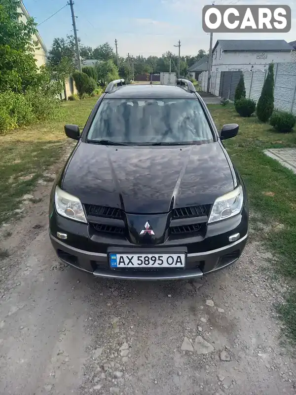 Позашляховик / Кросовер Mitsubishi Outlander 2008 2 л. Ручна / Механіка обл. Харківська, Зміїв - Фото 1/10