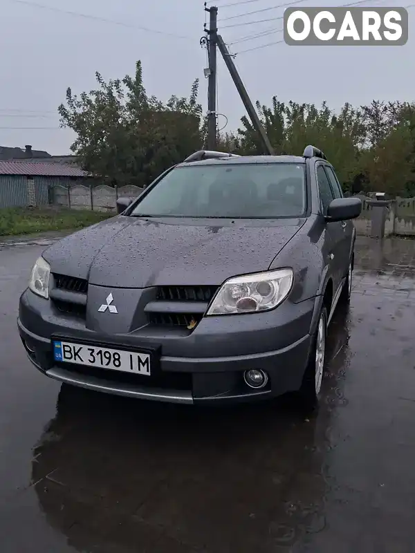 Позашляховик / Кросовер Mitsubishi Outlander 2009 2.38 л. Автомат обл. Рівненська, Острог - Фото 1/17