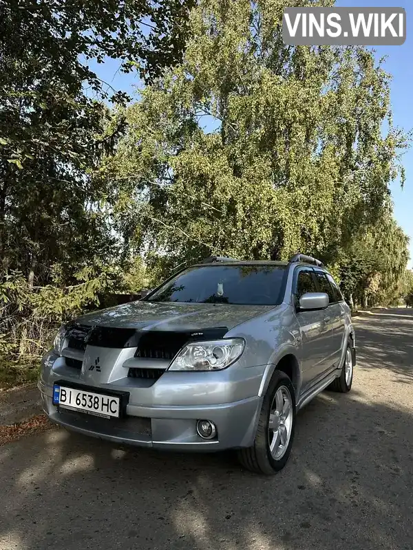 Позашляховик / Кросовер Mitsubishi Outlander 2009 2 л. Ручна / Механіка обл. Харківська, Первомайський - Фото 1/9