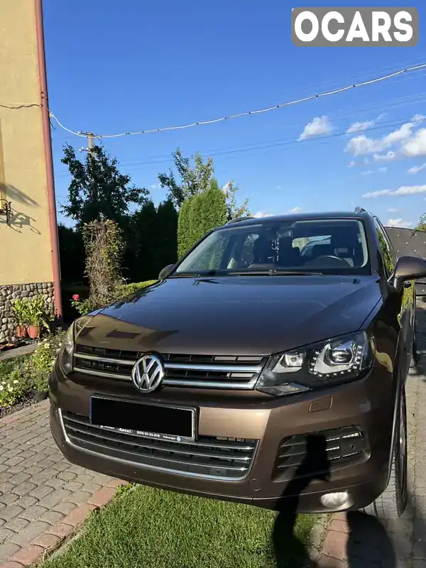 Позашляховик / Кросовер Volkswagen Touareg 2012 2.97 л. Автомат обл. Львівська, location.city.voroniaky - Фото 1/11