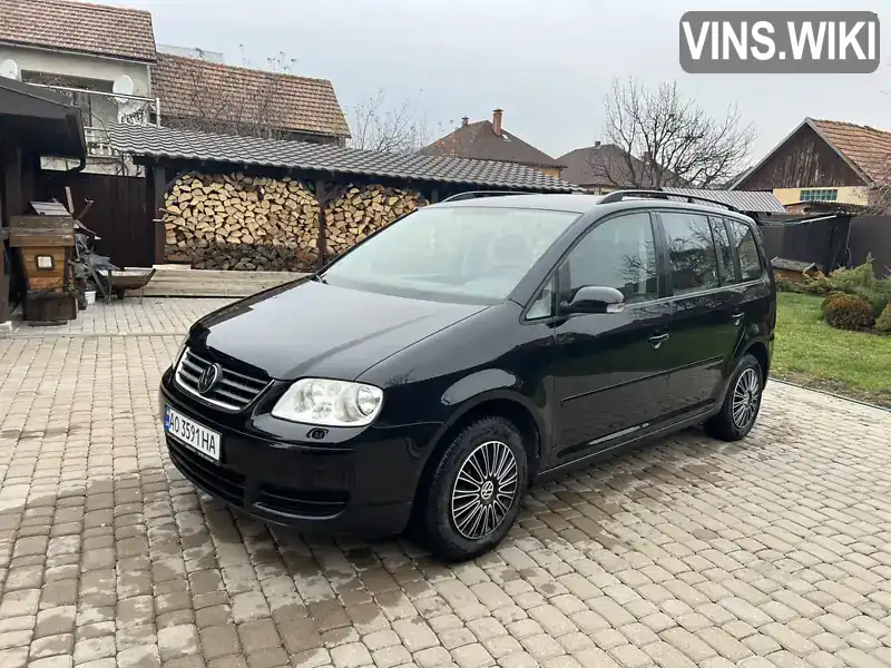 Мінівен Volkswagen Touran 2006 1.9 л. Ручна / Механіка обл. Закарпатська, Мукачево - Фото 1/21