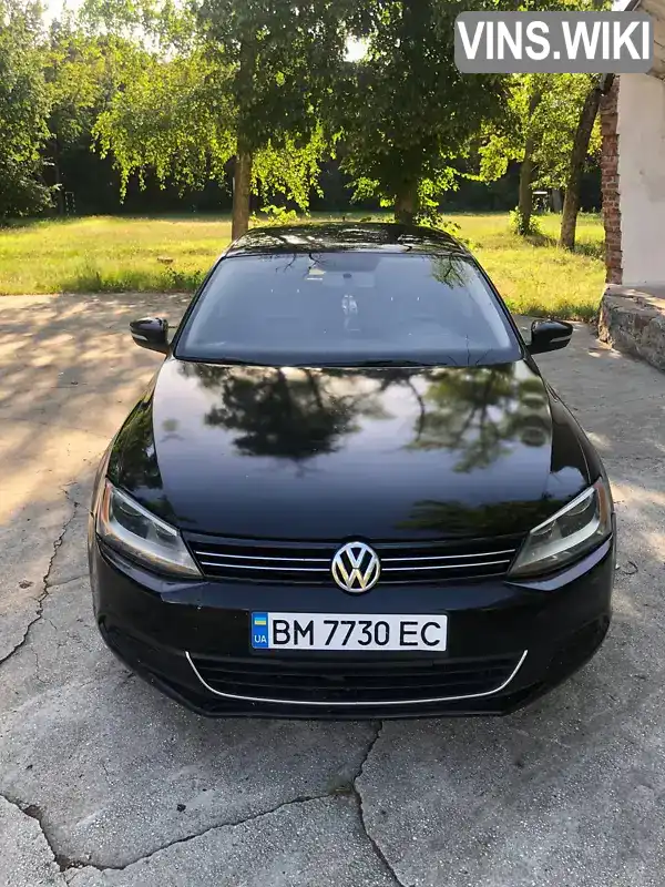 Седан Volkswagen Jetta 2014 1.8 л. Автомат обл. Сумська, Білопілля - Фото 1/11