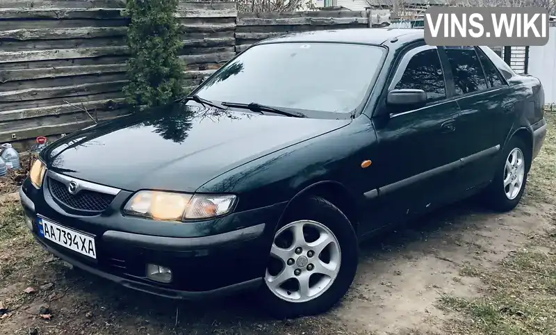 Седан Mazda 626 1998 2 л. Ручна / Механіка обл. Київська, Вишневе - Фото 1/21