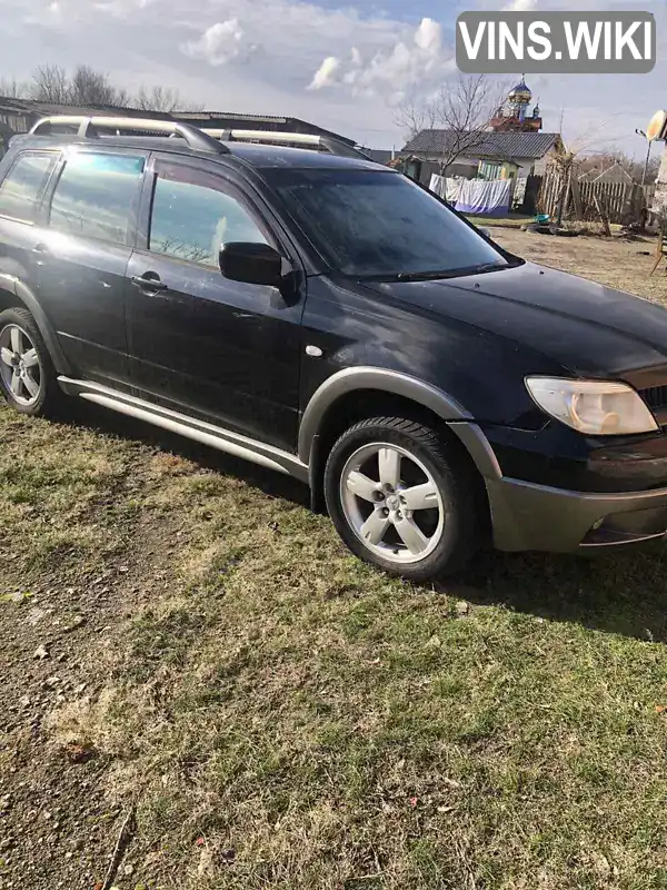 Позашляховик / Кросовер Mitsubishi Outlander 2006 2.38 л. Автомат обл. Харківська, Зміїв - Фото 1/8